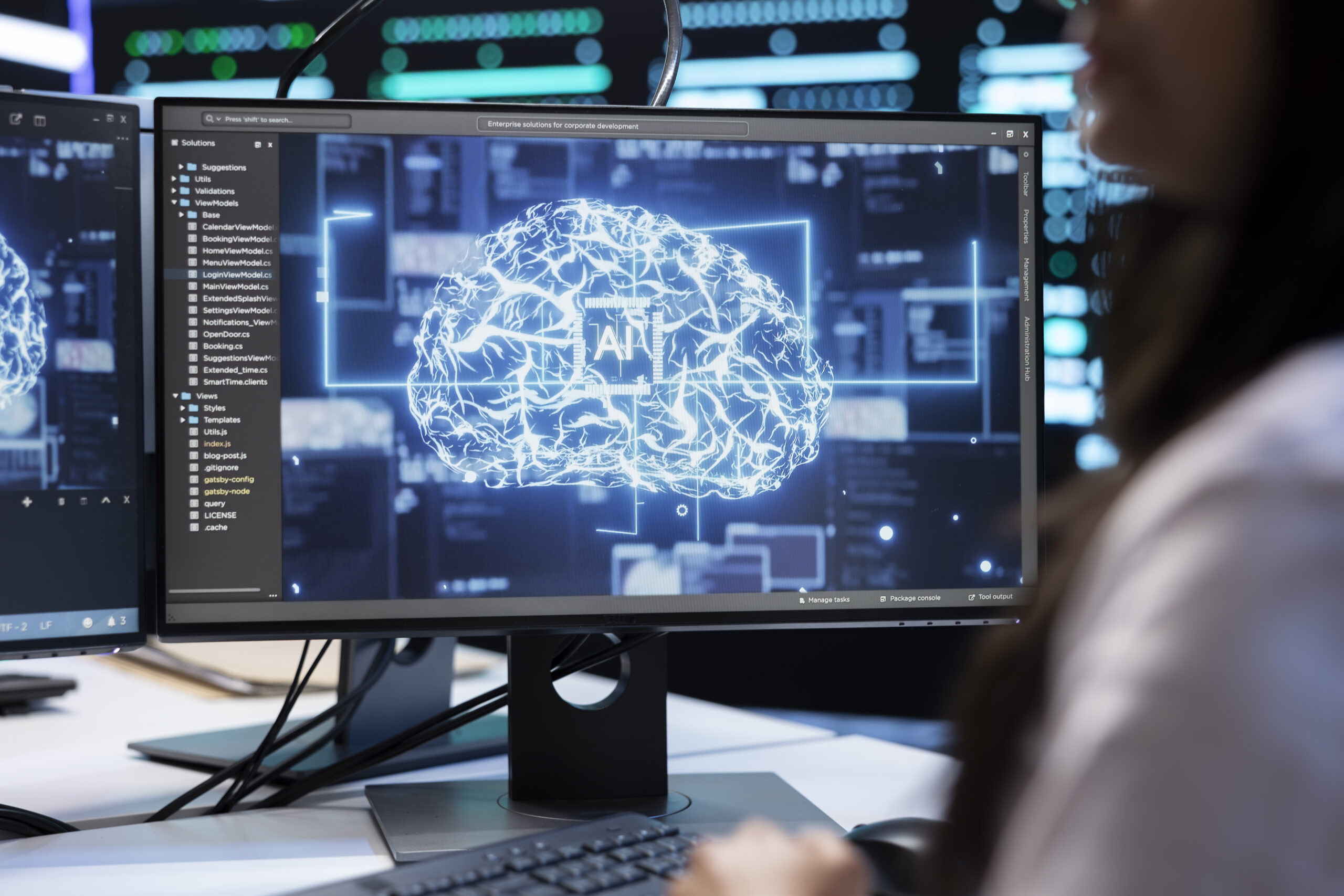 Close up shot of data center IT specialist using PC to enable AI