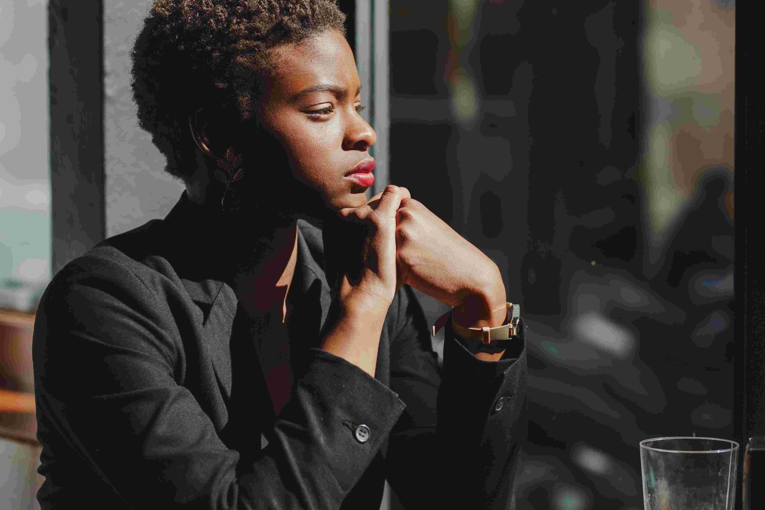 smiling-stylish-black-woman-in-cafe-2025-04-04-06-39-45-utc